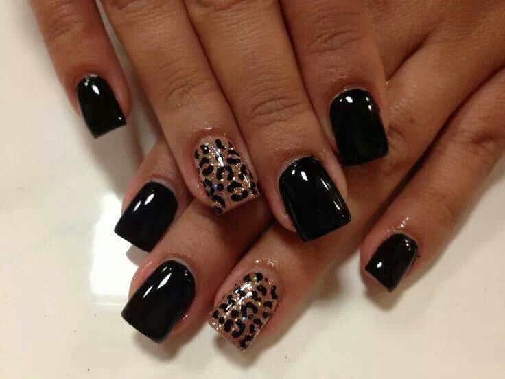 Chic Black Nail Design with Leopard Print Accent for Bold Elegance.