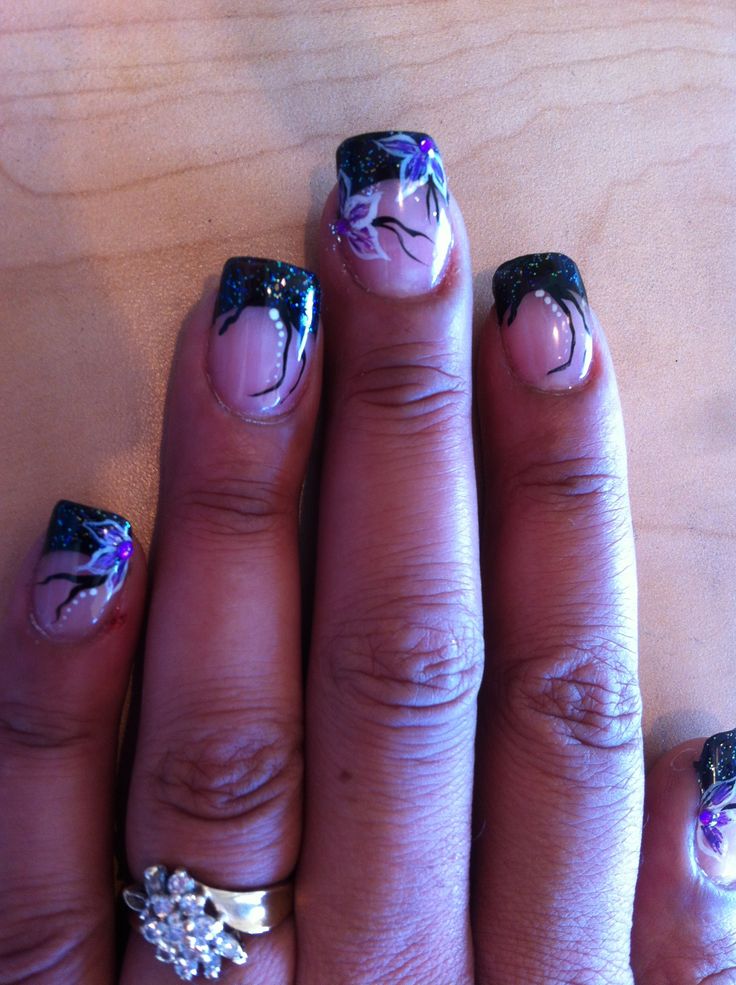 Sophisticated Nail Design: Dark Glitter Gradient with Vibrant Floral Accents