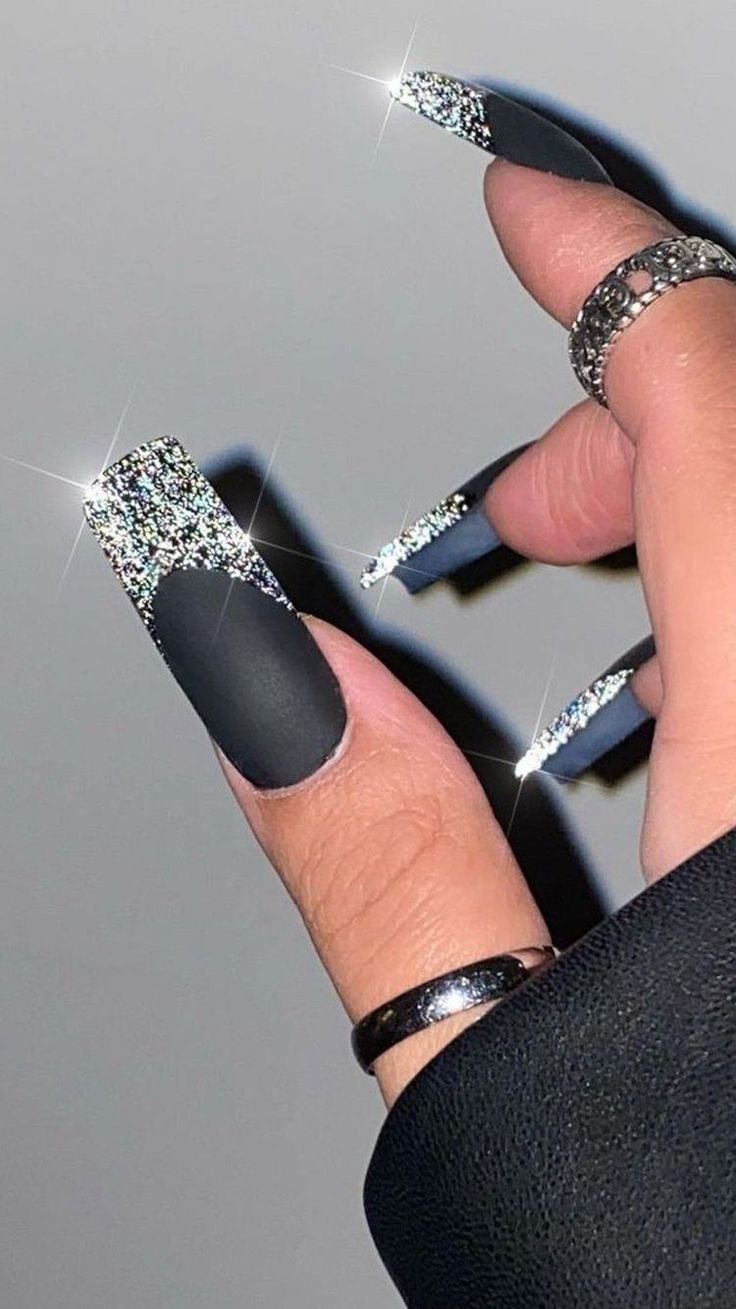 Bold Glamour: Elegant Matte Black Nails with Metallic Tips