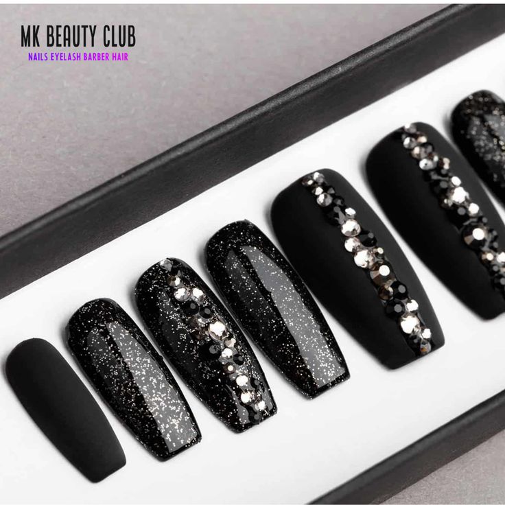 Chic Black Nail Design: Matte and Glossy Finish with Glitter Accents for Glamorous Occasions.