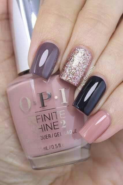 Sophisticated Nail Design: Glossy and Glitter Finishes in Rich Plum and Sleek Black.