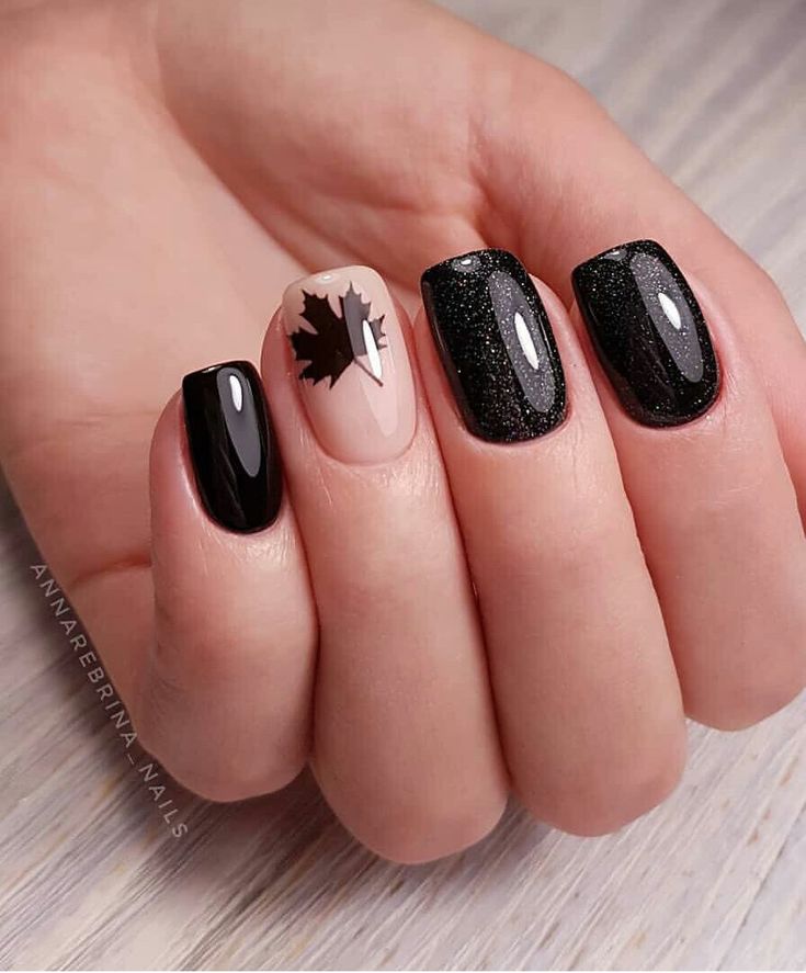 Chic Nail Design: Glossy Black with Nude Accent and Sparkly Glamour