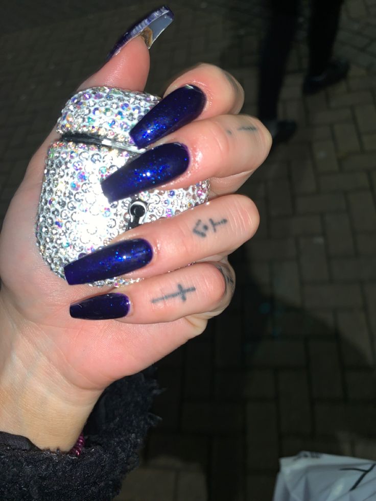 Bold and Glamorous Dark Blue Glitter Nails with Elegant Coffin Shape and Bedazzled Accents.