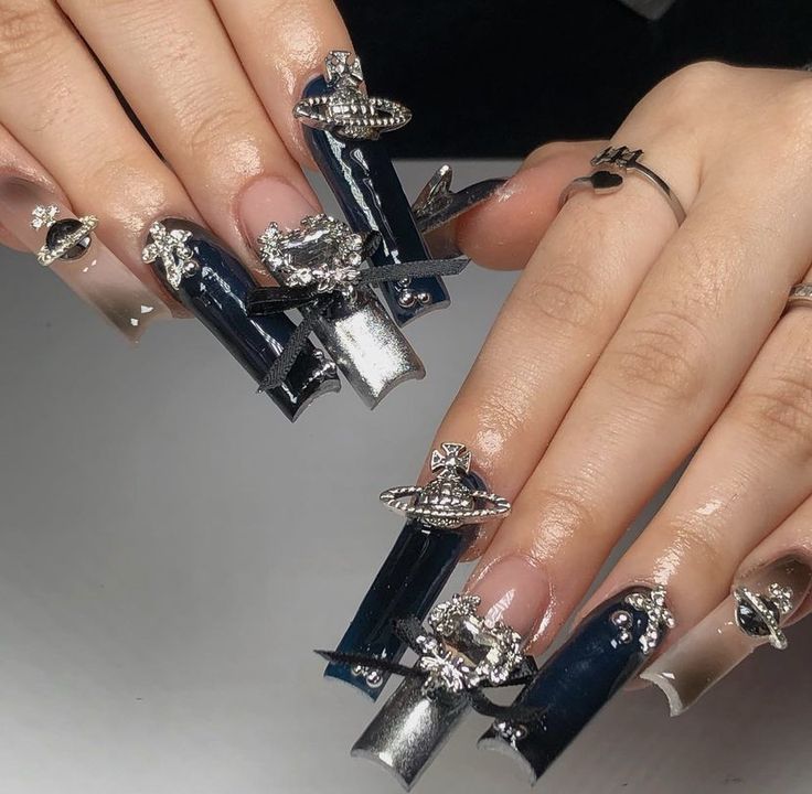 Cosmic-Inspired Nail Design: Striking Navy and Silver with 3D Planetary Embellishments