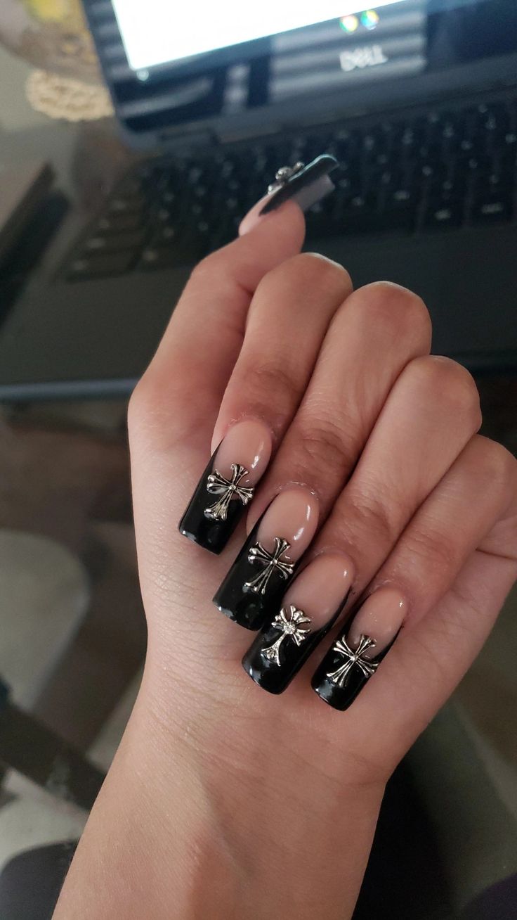 Chic Nail Design: Glossy Black Tips with Elegant Silver Bow Embellishments