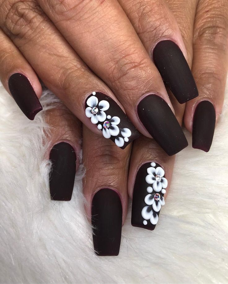 Striking Matte Black Floral Nails: A Perfect Blend of Elegance and Edginess.