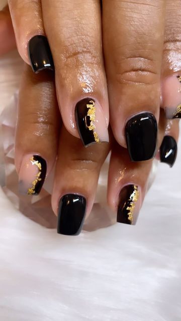 Chic Black and Nude Nail Design with Elegant Gold Foil Accents