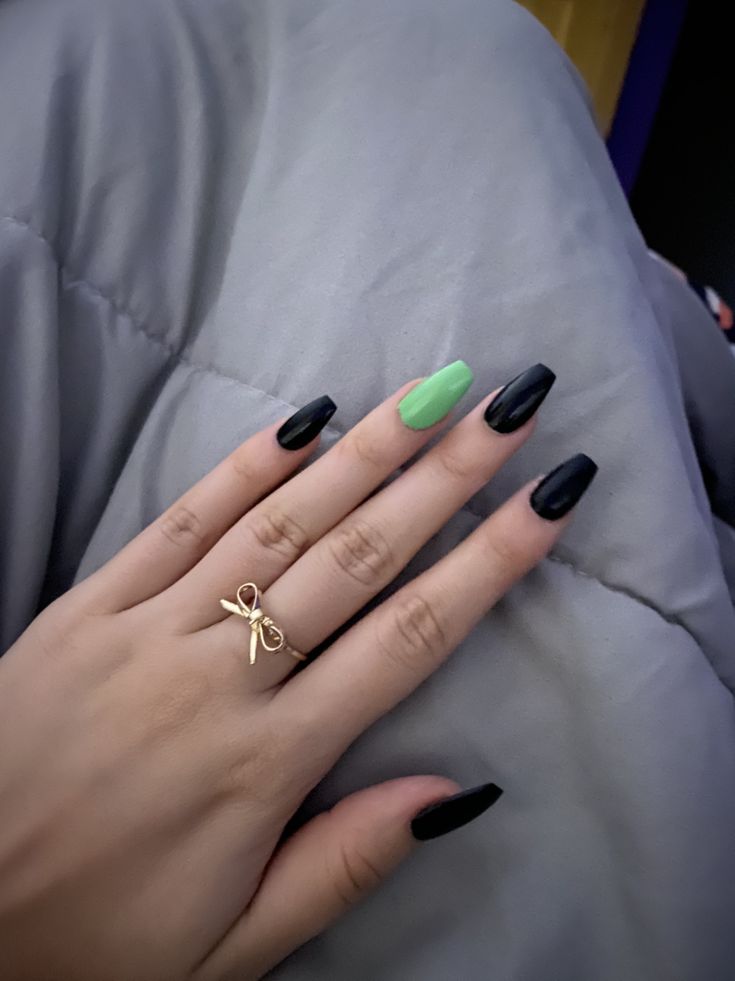 Edgy Chic Nail Design with Glossy Black and Vibrant Green Accents