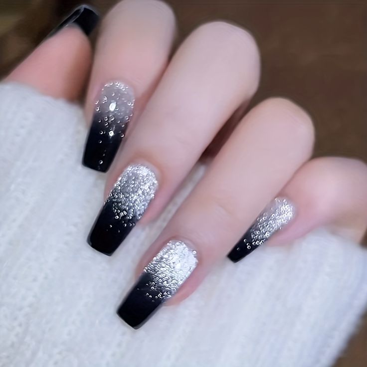 Glamorous Ombre Nail Design: Deep Black and Shimmering Silver with Textured Gradients and Sparkling Embellishments