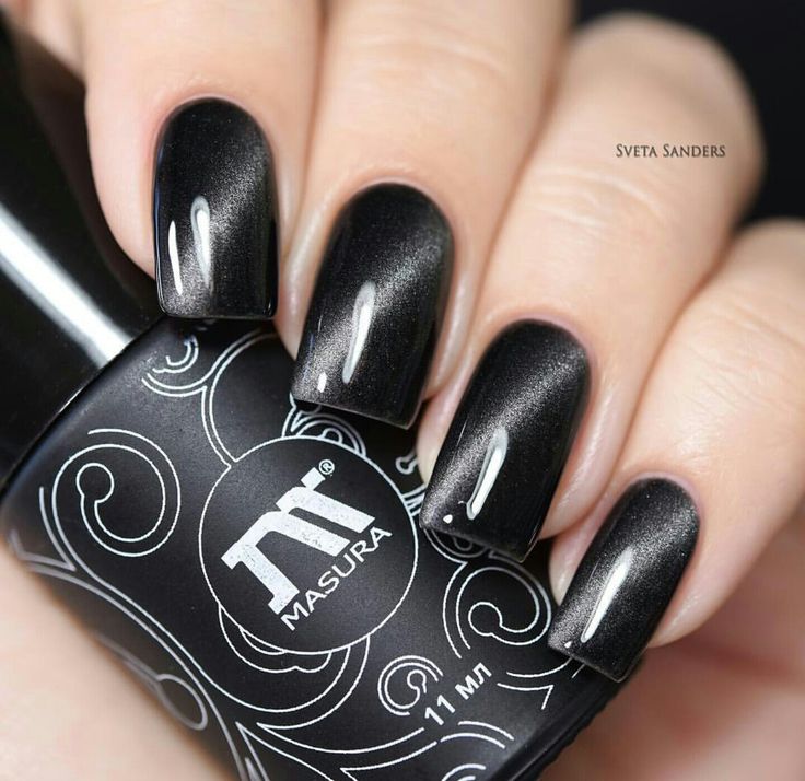 Sleek and Sophisticated Elegant Black Nail Design with Glossy Finish and Subtle Shimmer