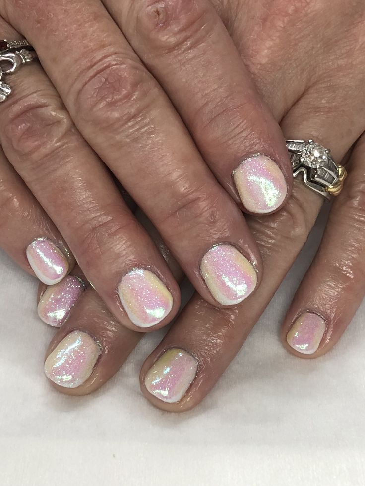 Pastel Ombre Glitter Nails: A Chic and Playful Design with Iridescent Sparkle.