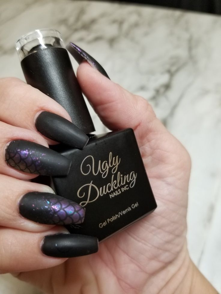 Sophisticated Black Matte Nails with Unique Purple Scale Pattern for a Bold Fashion Statement.