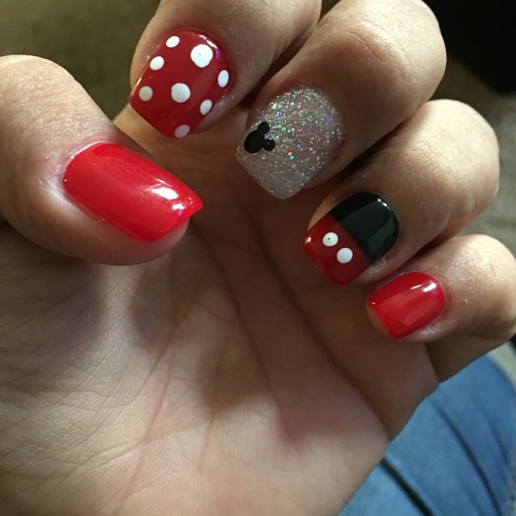 Whimsical Disney-Inspired Nail Design: Vibrant Red with White Polka Dots and Glittery Accent