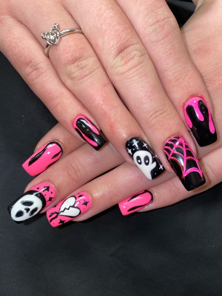 Eye-catching Halloween-Inspired Nail Design with Vivid Black and Neon Pink Colors, Featuring Ghosts and Spider Webs.