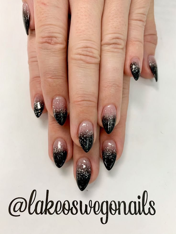 Elegant Pink and Black Gradient Almond Nails with Subtle Glitter Accent