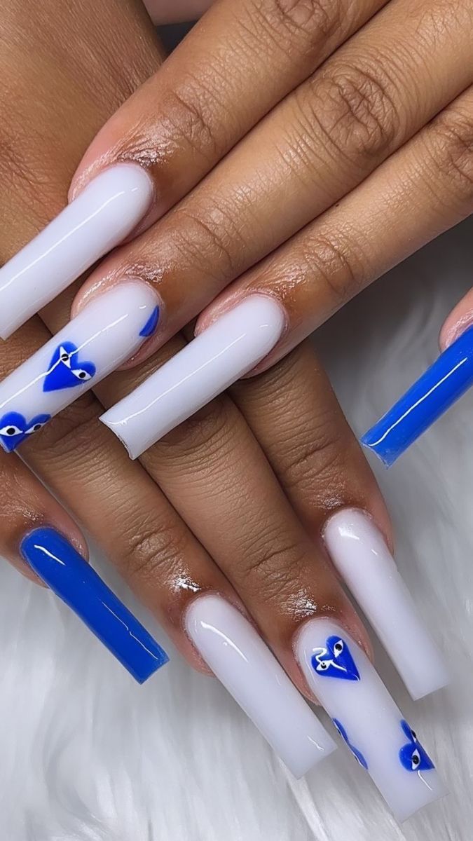 Glossy Blue and White Rectangular Nail Design: A Stylish Statement with Artistic Accents.