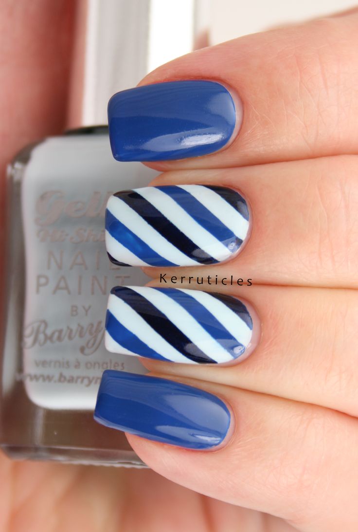 Chic Blue Nail Design with Bold Diagonal Stripes and Glossy Finish.