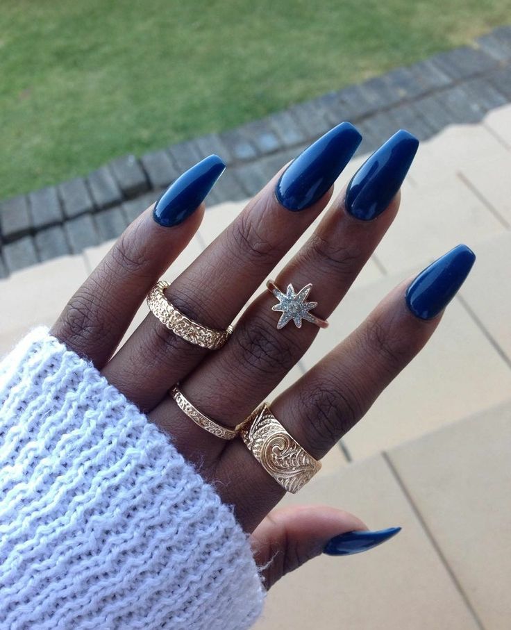 Elegant Navy Blue Nail Design with Glossy Finish and Gold Ring Accents