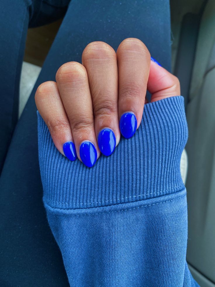 Elegant Glossy Blue Almond-Shaped Nail Design for a Bold Statement.