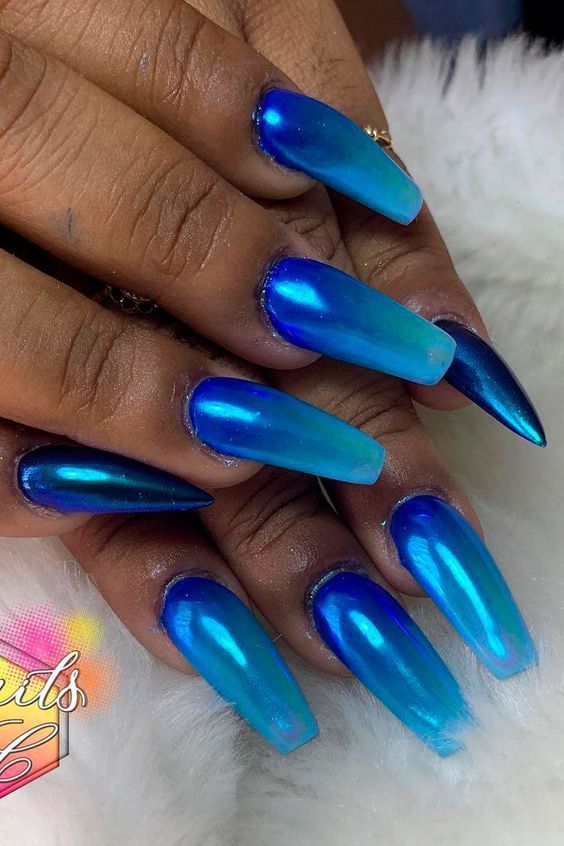 Stunning Blue Ombre Nails: A Chic Blend of Deep and Light Shades with Glossy Allure.