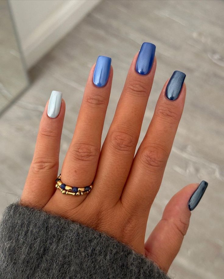 Sophisticated Glossy Blue Gradient Nail Design with Minimalistic Ring Accent