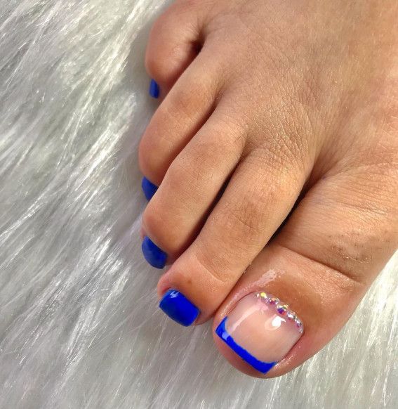 Chic Vibrant Blue Nail Design with Stylish Accents for Summer.