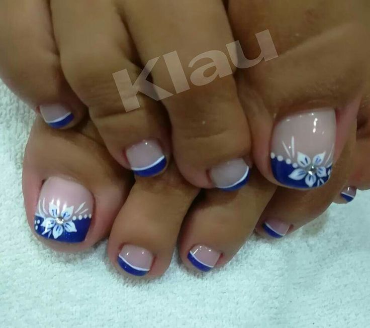 Elegant Nude and Blue Nail Design with Delicate Floral Patterns for Any Occasion