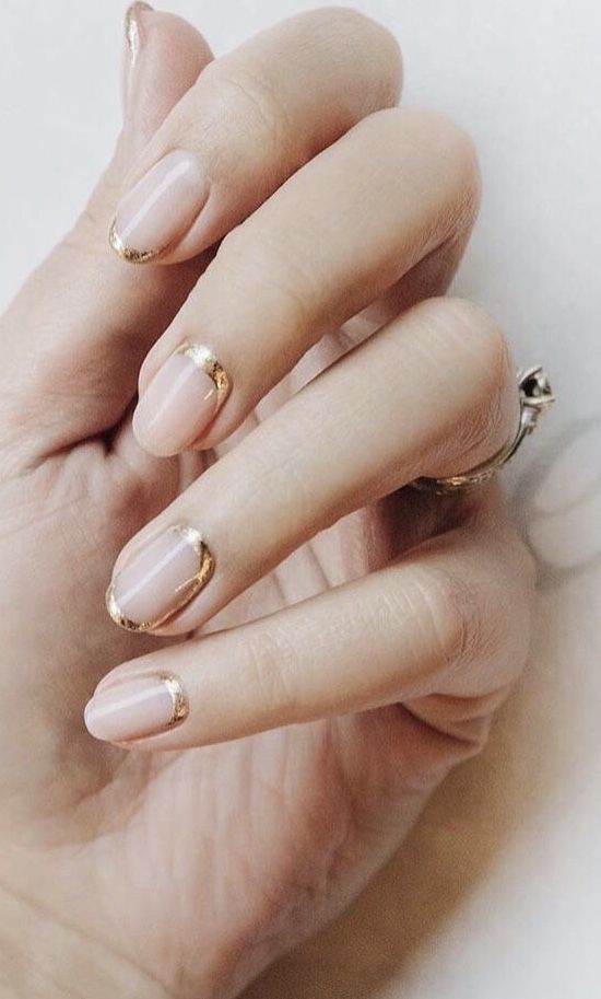 Chic Elegant Nude Nails with Delicate Gold Accents for a Sophisticated Look.