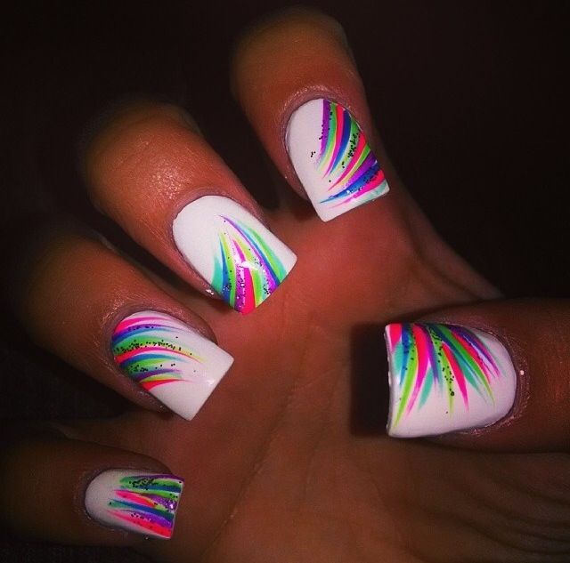 Dynamic Vibrant Nail Art: Bold Lines and Lively Colors on Crisp White Background.