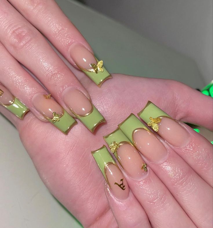 Elegant Green Ombre Nails with Glossy Finish and Golden Butterfly Accents in Chic Almond-Square Design.