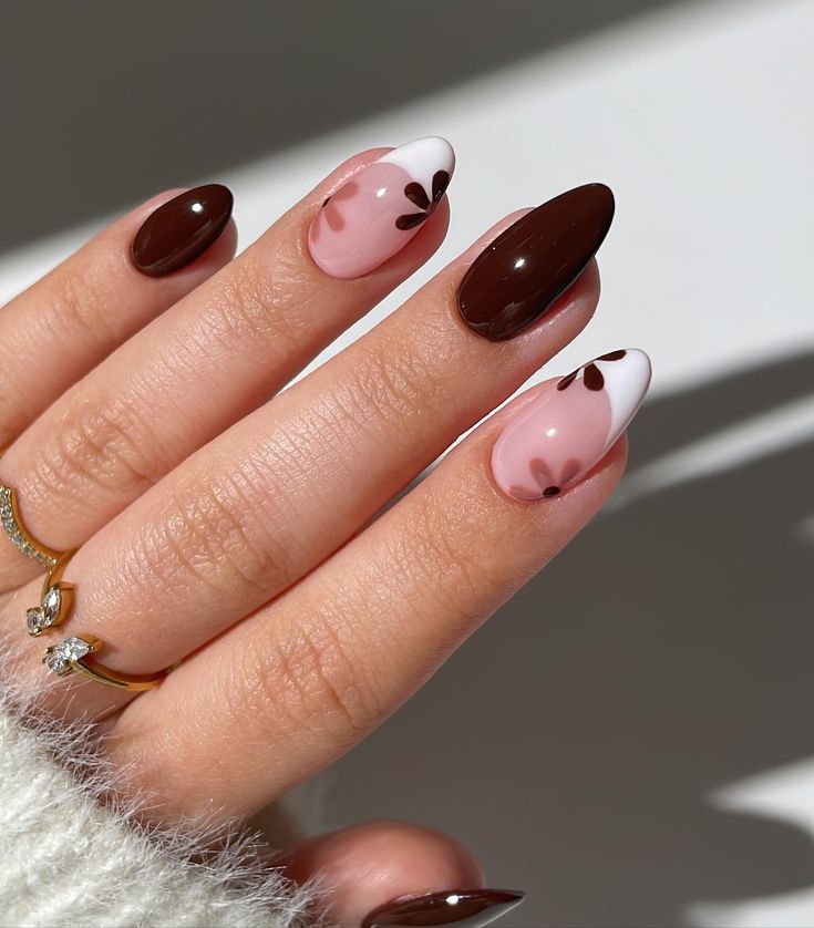 Chic Almond-Shaped Nail Design with Brown and Soft Pink Hues and Floral Accents