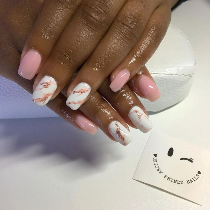 Sophisticated Pink and White Nail Design with Marbled Rose Gold Accents.