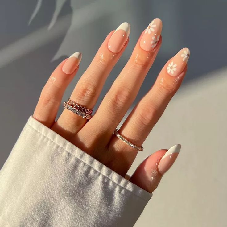 Elegant Floral Nail Art with Nude Base and White Tips for a Sophisticated Look