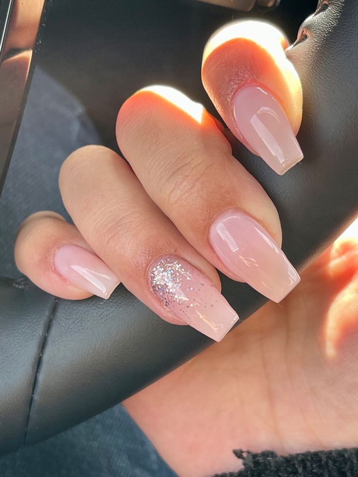 Sophisticated Nude Nail Design with Sparkling Accent for Any Occasion.