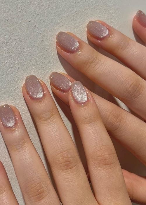 Sophisticated Elegant Nude Nail Design with Gradient Effect and Subtle Sparkle.