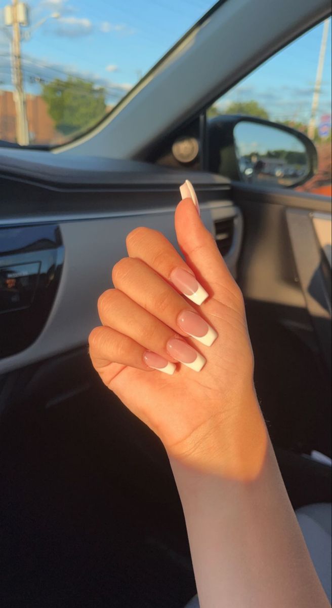 Sophisticated Ombre French Manicure with Nude Base and Crisp White Tips.