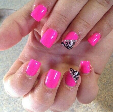 Vibrant Pink Nails with Chic Animal Print Accent: A Perfect Blend of Fun and Sophistication.