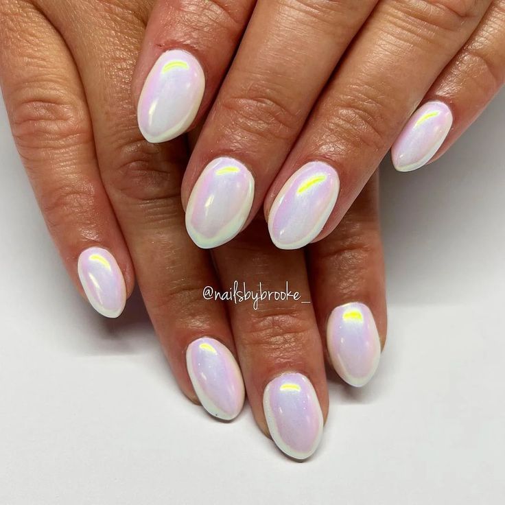 Sophisticated Oval Nail Design with Pearlescent Finish and Clean White Tips.