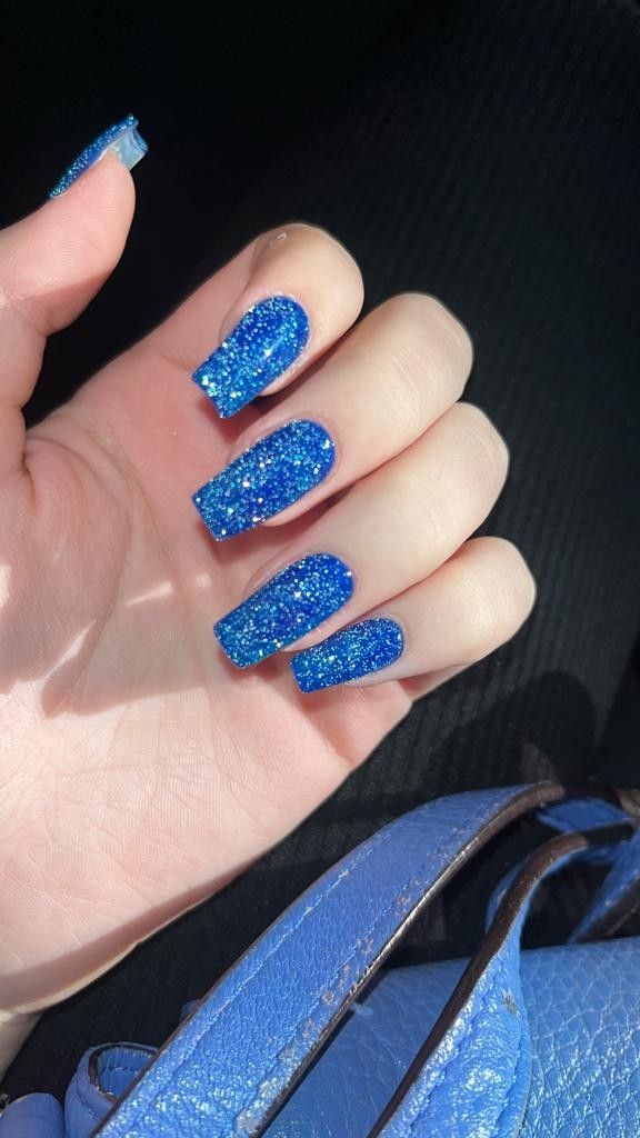 Vibrant Blue Glitter Nail Design with Long Square Shape for Elegant Style.