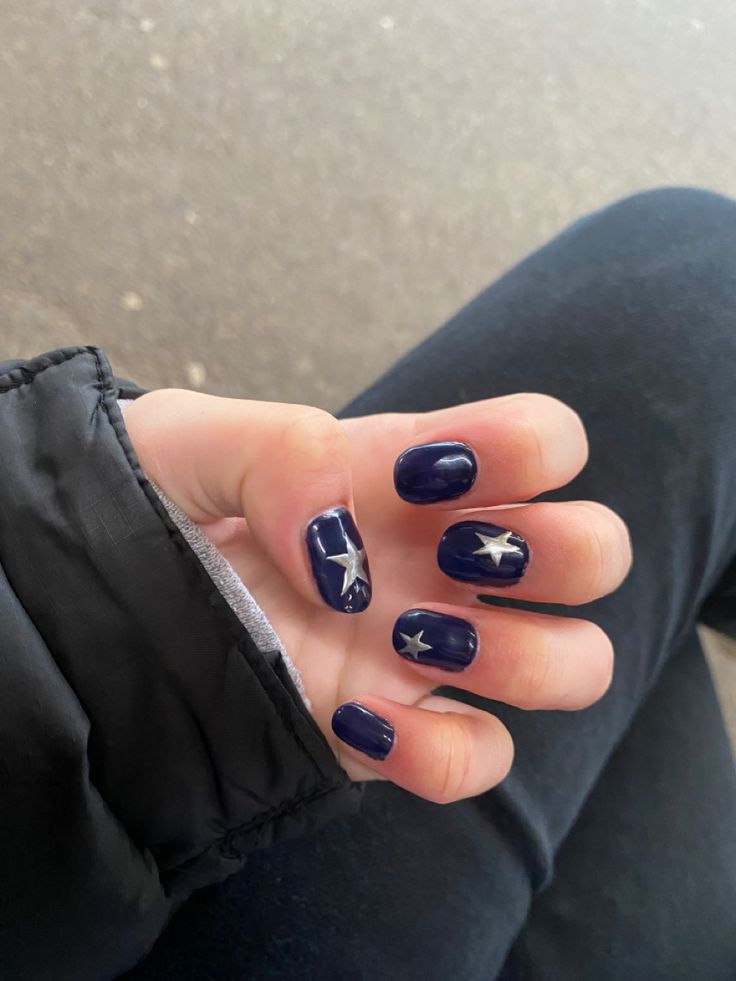 Celestial-Inspired Starry Nail Design with Deep Navy Base and Silver Accents.