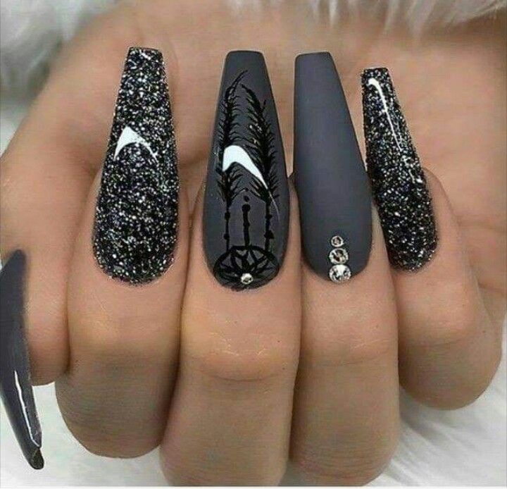 Elegant Glamorous Black Nail Art with Matte, Glitter, Floral Motifs, and Rhinestone Accents.