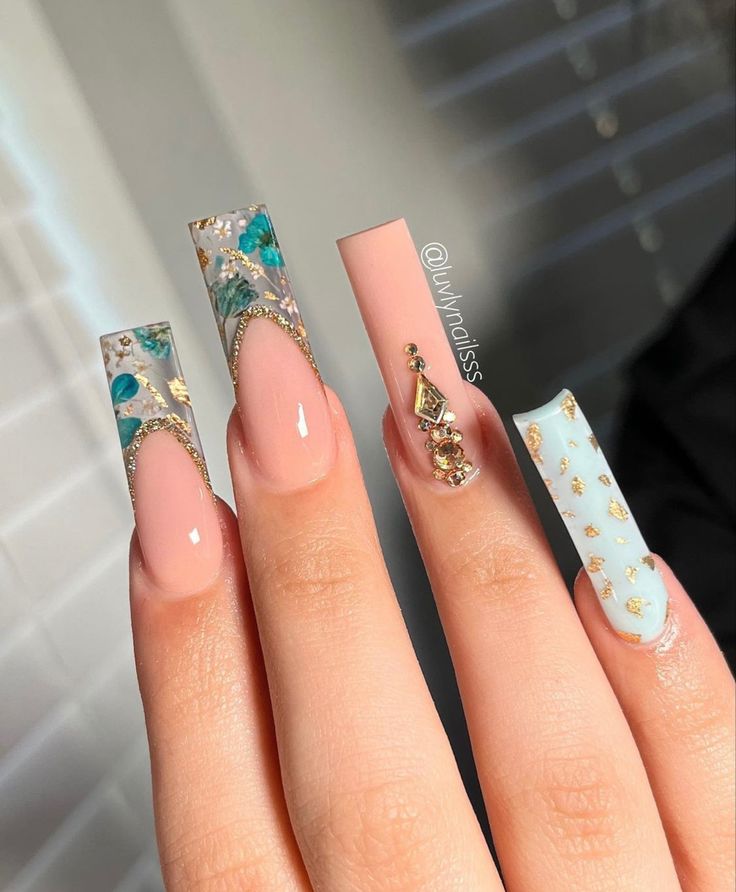 Sophisticated Pastel Pink Nail Art with Floral and Geometric Accents.