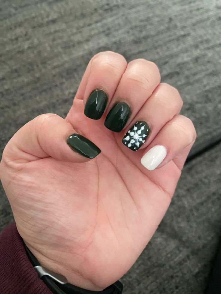 Sophisticated Deep Green and White Accent Nail Design for a Chic Look.