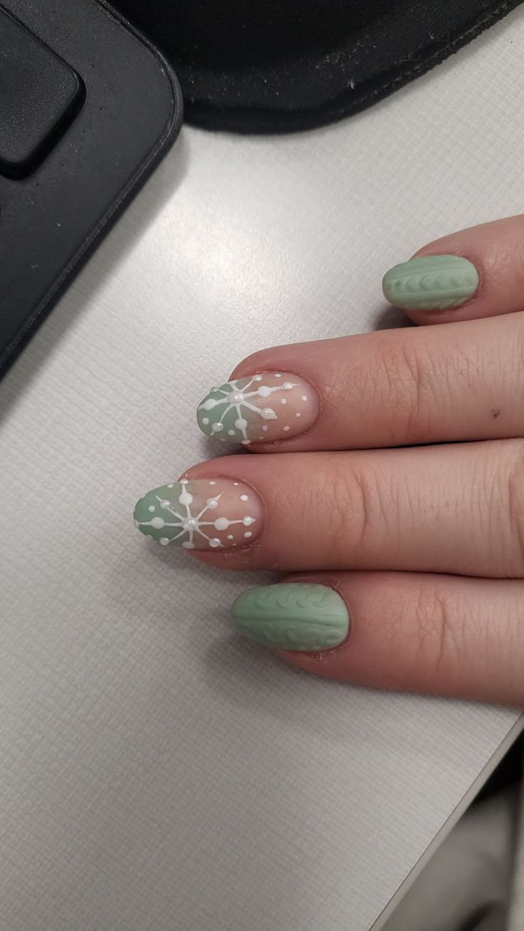 Elegant Pastel Green and Beige Nail Design with Whimsical White Patterns