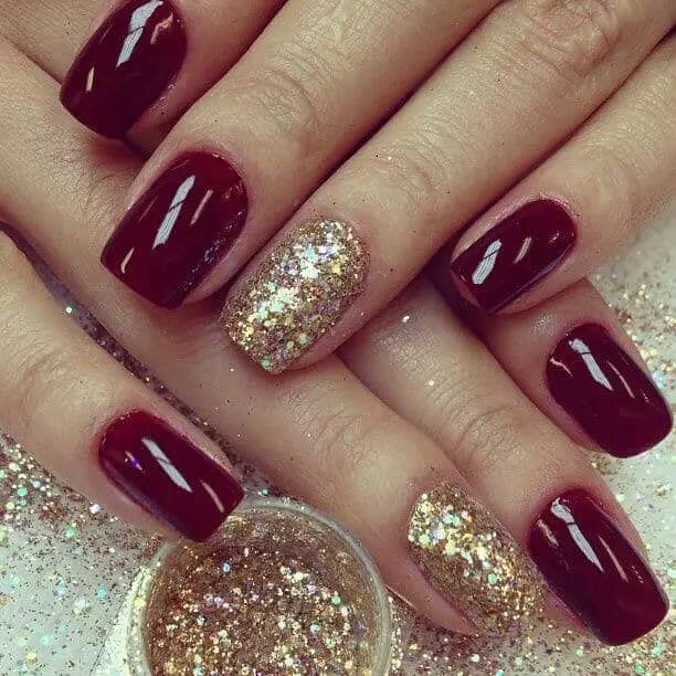 Glamorous Red Nail Design with Glossy Crimson and Sparkling Gold Glitter Accent