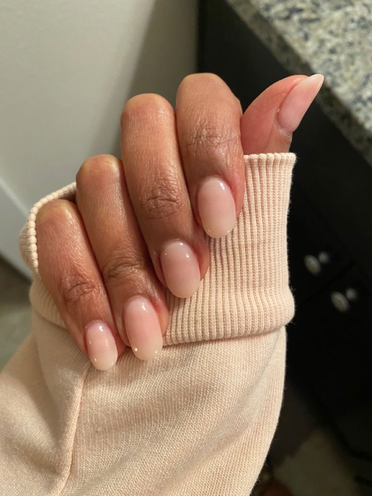 Sophisticated Almond-Shaped Nude Nail Design with Chic Gradient Effects.