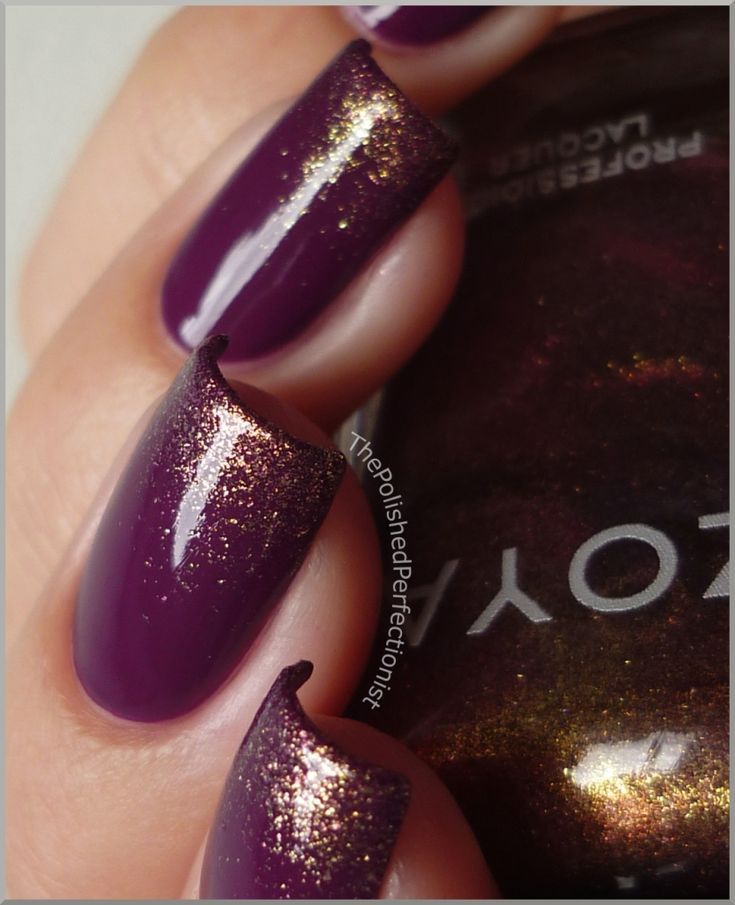 Sophisticated Deep Purple Nail Design with Striking Golden Accents.