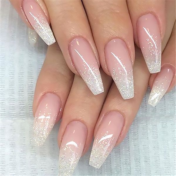 Chic Ombre Nail Design: Soft Nude to Sparkling White with Elegant Tapered Shapes