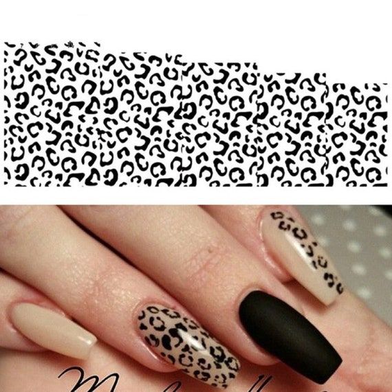 Chic Leopard Print Nail Design: Bold Matte Black and Nude Elegance for Fashion-Forward Style.