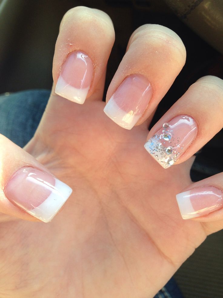 Chic French Tip Nail Design with Sparkling Accent for Elegant Versatility.